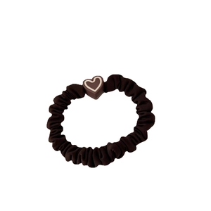 Minimalist black scrunchie with brown heart charm and high-elastic hair tie design