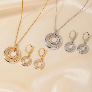 Elegant gold and silver dual-circle necklace and earrings set with micro-pave cubic zirconia