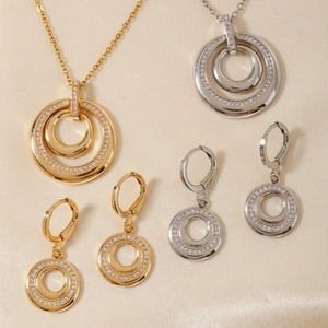 Elegant gold and silver interlocking circle jewelry set with shimmering crystals
