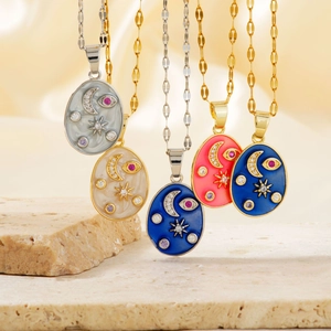 Elegant oval enamel pendant necklace featuring celestial star and moon motifs with zircons