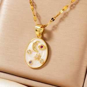 Elegant gold necklace with star and moon zircon pendant on a luxury jewelry box