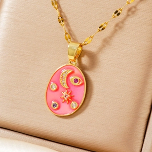 Detailed close-up of pink enamel star and moon pendant necklace on silk jewelry box texture
