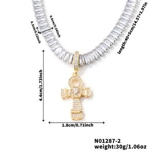 Golden tennis chain with iced out Ankh cross pendant and dimensions on white background