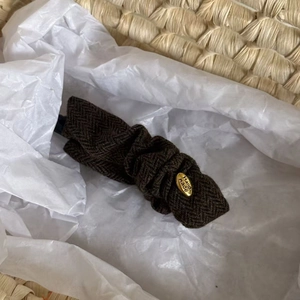 Vintage brown herringbone fabric banana hair clip with golden Hand Made metal logo detail
