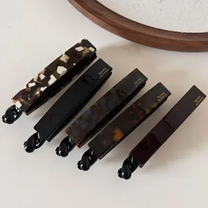 Lot de cinq pinces banane en acétate de style français avec motifs écaille et unis