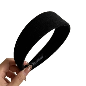 Minimalist black wool velvet wide headband for women featuring a handmade interior label