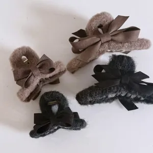 Plush bow hair claws in black and brown colors, minimalist velvet shark clips for women