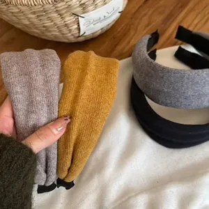 Set of four wide knitted wool headbands in yellow, grey, purple and black for women