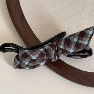 Detail of checkered plaid bow banana clip for ponytail made of thick cotton fabric