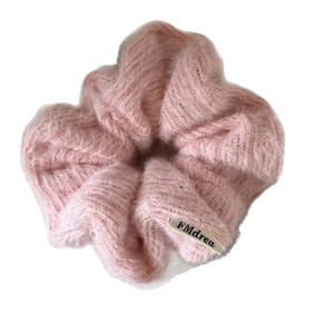 Pink plush knit scrunchie with soft faux mohair texture and branded woven label