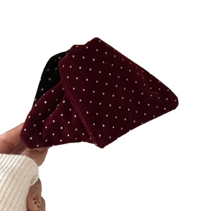 Vintage red velvet hair claw clip with polka dot bow for elegant hairstyles