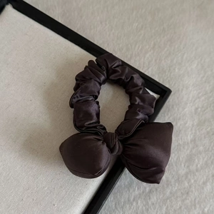 Elegant dark brown satin bow scrunchie for women with a silky finish and large butterfly design