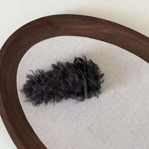 Plush lamb wool dark grey hair clip with black leather bow accent for autumn and winter
