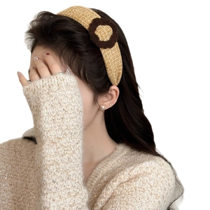 Chic mustard yellow knitted plaid headband with ring accent for winter hair styling