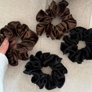 French velvet scrunchies set in black and dark brown with elegant ruffled texture