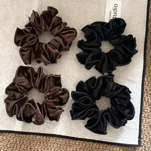 4-pack velvet hair scrunchies in black and dark brown with delicate ruffled edges