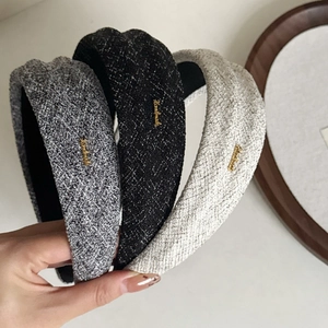 Vintage tweed wide headbands in grey, black, and beige with a gold 'Handmade' label