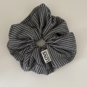 Gray and black striped knit hair scrunchie with Love From Seoul woven label tag