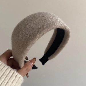Detail of plush knitted headband showing thick texture and black matte non-slip lining