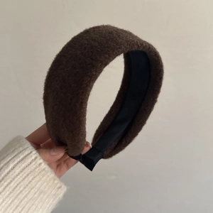 Detail of mocha brown plush headband showing the textured faux fur fabric and thick padded design