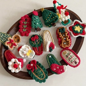 Handmade crochet Christmas hair clips set featuring Santa, tree and reindeer designs