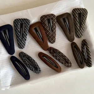 Set of 11 vintage Fair Isle hair clips featuring checkered fabric and flocked textures