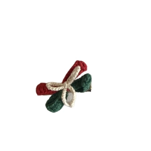 Handmade crochet Christmas bow hair clip in red green and white festive colors