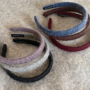Handmade knitted wool headbands in six elegant autumn colors with a soft texture