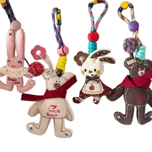 Set of four cute knitted animal plush charms with embroidery and colorful beads