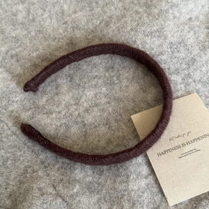 Chic dark brown knitted headband for women with a warm autumn and winter texture