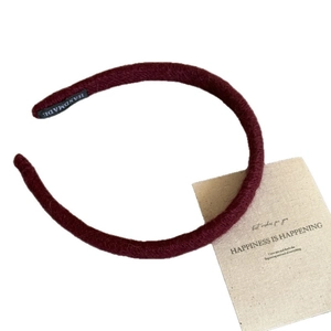 Deep burgundy knitted slim headband with handmade label and aesthetic card detail