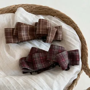 Vintage plaid fabric bow banana hair clips in brown and red patterns for elegant ponytails