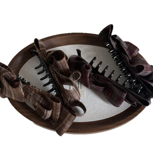 Three plaid bow banana hair clips in brown and burgundy for elegant ponytails