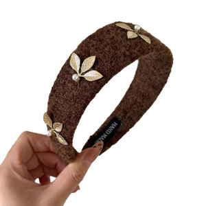 Brown wool tweed headband with golden leaf accents and pearls for a vintage fall look