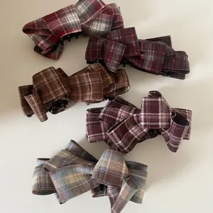 Set of 5 vintage plaid fabric bow hair claws in various autumn colors on white background