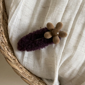 Winter plush purple flower hair clip for women with cozy lamb wool texture and floral detail