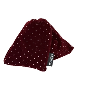 Vintage burgundy velvet hair claw with pink polka dots and fashion label on white background