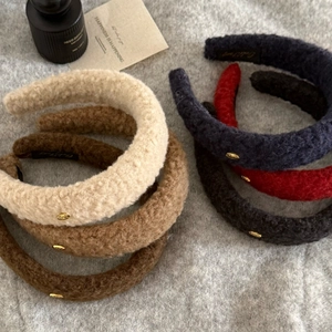 Plush lamb wool headbands with gold labels in six warm colors for autumn winter look