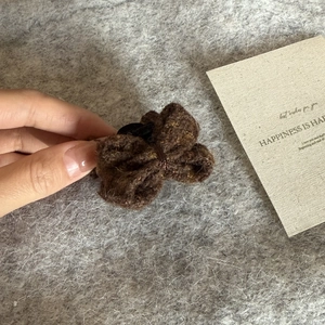 Deep brown knitted double bow hair claw clip made of elegant tweed wool for women
