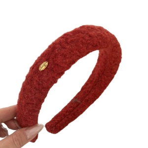 Caramel fleece headband with high top design and golden metal logo tag for women
