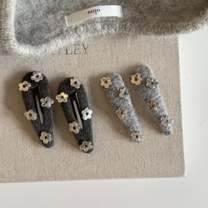 Set of 4 grey knit hair clips with silver floral accents for women's stylish hair accessories