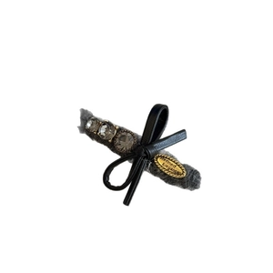 Elegant grey plush hair clip with rhinestones and a black leather bow decoration