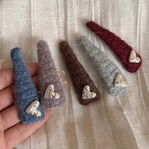 Five-piece plush knit heart hair clips set in assorted colors with silver rhinestone detail