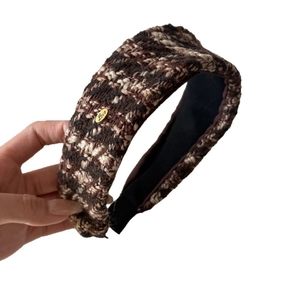 Brown and beige tweed headband with wide brim and gold metal Love charm detail