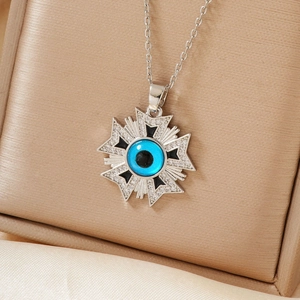 Elegant evil eye star necklace with blue center and sparkling zircon stones on gold silk