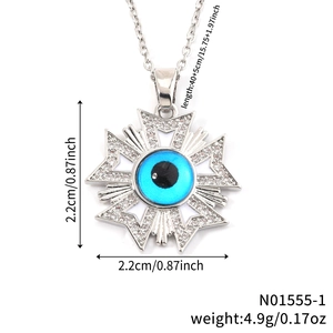 Evil eye pendant necklace with light blue stone and irregular starburst frame in silver
