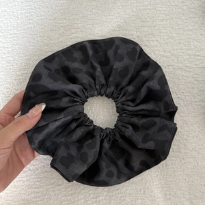 Elegant large leopard print scrunchie in dark grey satin fabric for women's hair styling