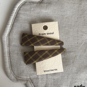 Set of two vintage plaid fabric hair clips in red and blue pattern on display card