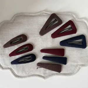 Retro knit hair clip set in dark red and brown tones with vertical texture