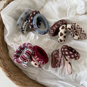 Set of 4 vintage knitted hair ties with heart and geometric patterns in warm tones